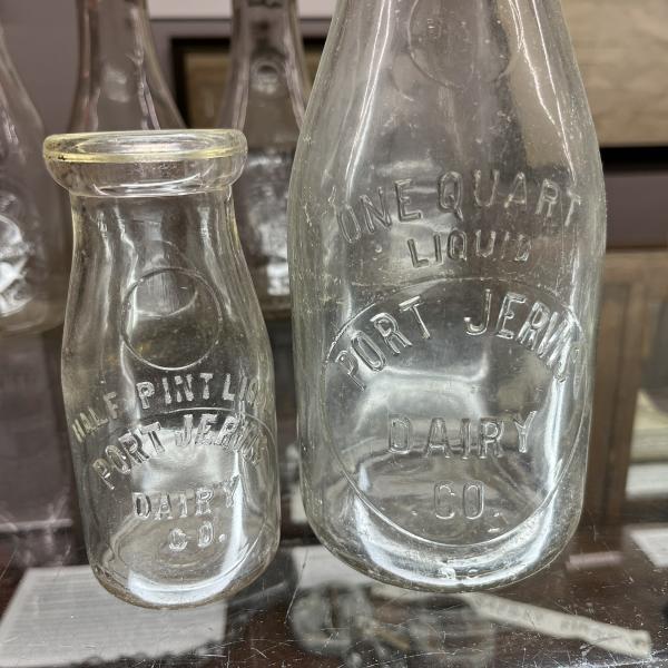 Two milk bottles from Port Jervis Dairy Co. (one quart bottle and one pint bottle)