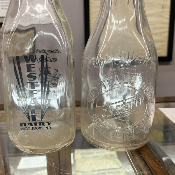 Two milk bottles from Westfall Dairy / C. S. Cooper (one quart bottle and one pint bottle)