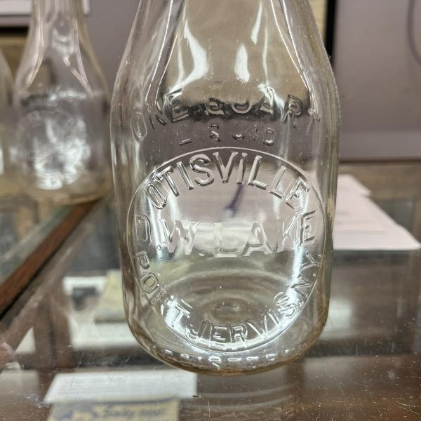 One quart milk bottle from Otisville Dairy / D.W. Lake