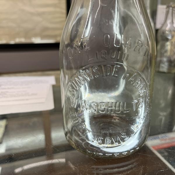 One quart milk bottle from Sunnyside Farm / W.W. Schultz