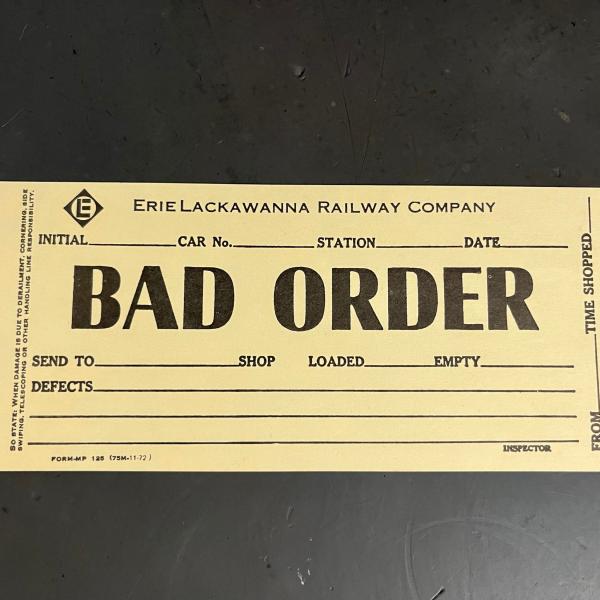 Erie Lackawanna bad order tag (tan), November 1972