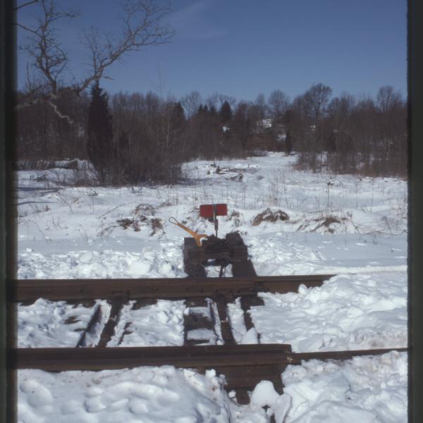 Photograph of Middletown & New Jersey switch to runaround siding, Slate Hill, NY, March 6, 1993