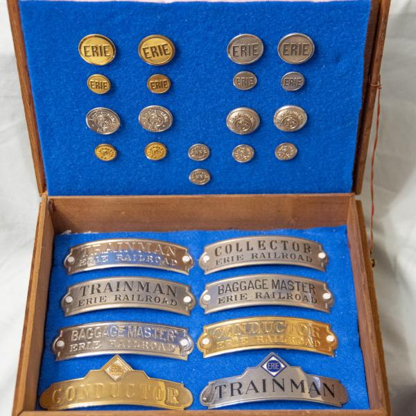 Wooden Box of Erie, Lackawanna, and New Jersey & New York Uniform Buttons and Hat Badges