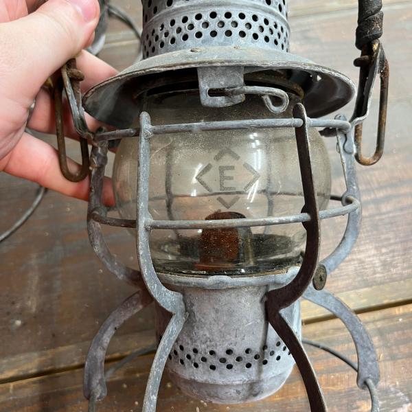Armspear lantern, marked with Erie diamond on dome and etched Erie diamond on clear globe