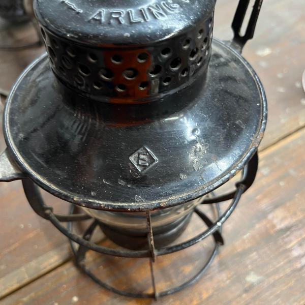 Dressel lantern, painted black, marked with Erie diamond on dome and cast Erie diamond on globe