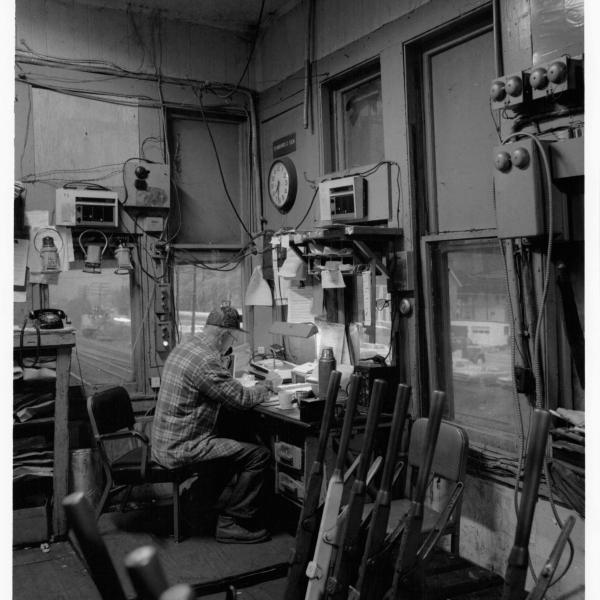 Four photographs of Erie Lackawanna tower operator in Suffern, NY