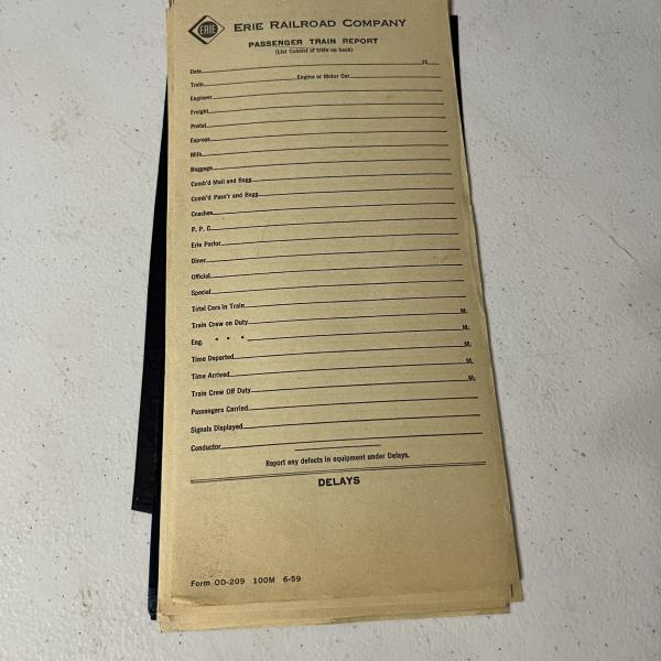 Stack of Erie Railroad passenger train reports, June 1959
