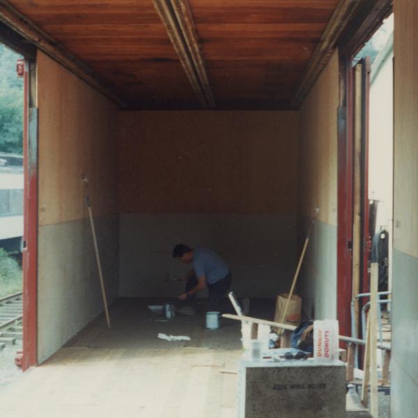 Photograph of interior of Conrail Safety on Rails Theater boxcar 368191 being outfitted at Morristown & Erie Railway Morristown Yard, Morristown, NJ, spring 1992