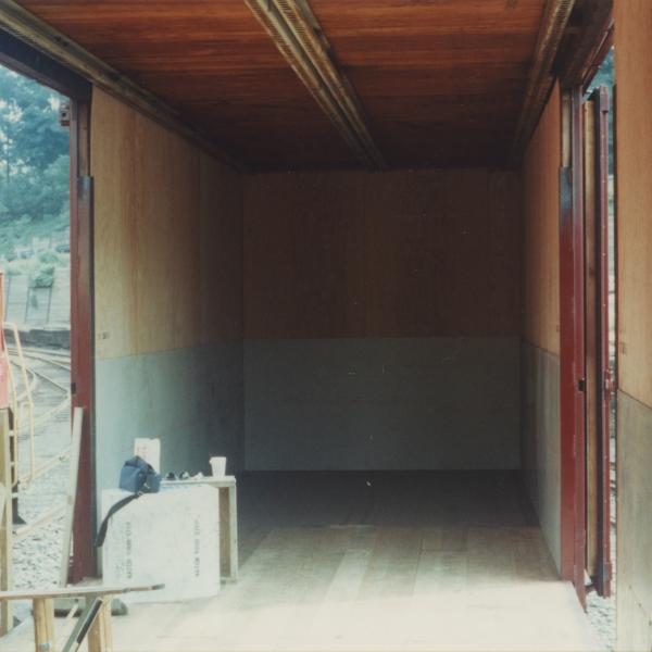 Photograph of interior of Conrail Safety on Rails Theater boxcar 368191 being outfitted at Morristown & Erie Railway Morristown Yard, Morristown, NJ, spring 1992