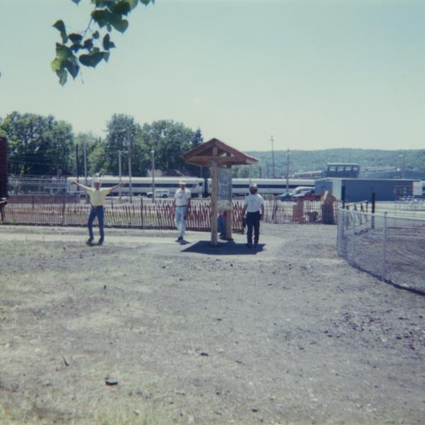 Photograph of exterior of Conrail Safety on Rails Theater boxcar 368191 and crew at Port Jervis, NY, July 1996