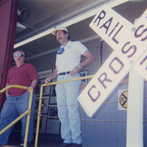 Photograph of exterior of Conrail Safety on Rails Theater boxcar 368191 and crew at Port Jervis, NY, July 1996