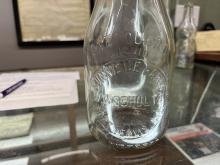 One quart milk bottle from Sunnyside Farm / W.W. Schultz