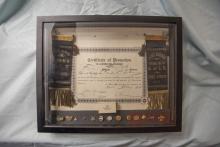 Display case with Erie Railroad Certificate of Promotion to Locomotive Engineer for Claude R. Skinner, May 20, 1924, with ribbons from Brotherhood of Locomotive Engineers Division, No. 54, Port Jervis, NY and assorted BLE anniversary pins