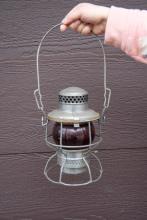 Adlake lantern, marked EL with red unmarked globe