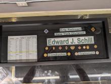 Boxed display of union and service pins from Edward J. Schill, Erie trainman and conductor