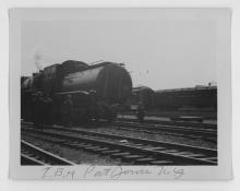Ziploc bag of assorted black and white railroad photo prints