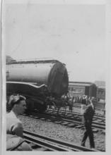 Ziploc bag of assorted black and white railroad photo prints