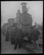 Ziploc bag of assorted black and white railroad photo prints