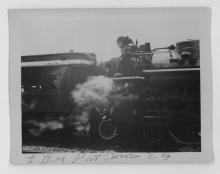 Ziploc bag of assorted black and white railroad photo prints