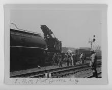 Ziploc bag of assorted black and white railroad photo prints