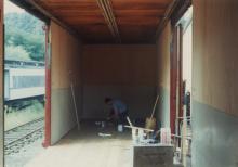 Photograph of interior of Conrail Safety on Rails Theater boxcar 368191 being outfitted at Morristown & Erie Railway Morristown Yard, Morristown, NJ, spring 1992