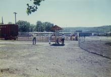 Photograph of exterior of Conrail Safety on Rails Theater boxcar 368191 and crew at Port Jervis, NY, July 1996
