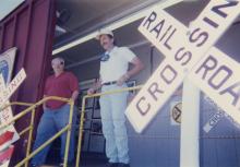 Photograph of exterior of Conrail Safety on Rails Theater boxcar 368191 and crew at Port Jervis, NY, July 1996